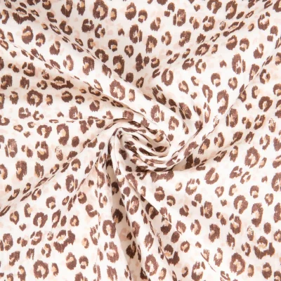 Tissu Double gaze de Coton Karli Léopard doré sur fond Ecru - Par 10 cm