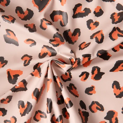 Tissu Imperméable déperlant Saian coeurs Orange sur fond Beige - Par 10 cm