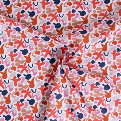 Tissu Coton imprimé Swigo Caramel et rose sur fond Blanc - Par 10 cm