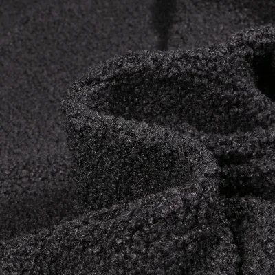 Tissu Fausse fourrure Teddy Bouclettes sur fond Noir - Par 10 cm