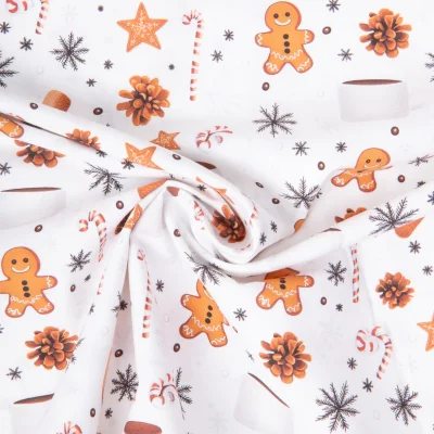 Tissu Coton imprimé Petit biscuit gouter de Noël sur fond Blanc - Par 10 cm
