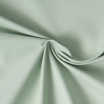 Tissu Coton uni Vert pâle - Par 10 cm