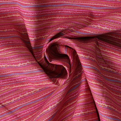 Tissu Coton imprimé  Strya sur fond Bordeaux - Par 10 cm