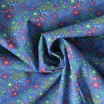 Tissu Coton imprimé  fleuris Florya sur fond Bleu denim - Par 10 cm