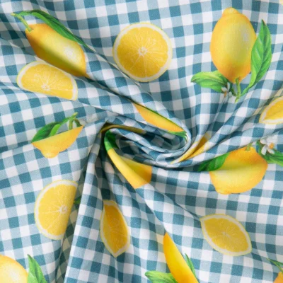 Tissu Coton imprimé Carreaux bleu et citrons, oranges jaunes sur fond Blanc - Par 10 cm