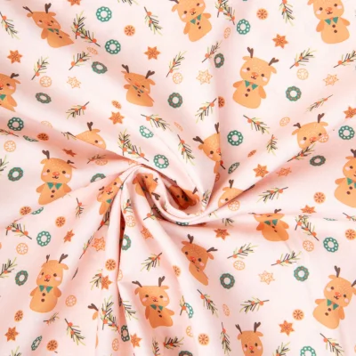 Tissu Coton imprimé Rudolph rennes festifs sur fond Rose pâle - Par 10 cm
