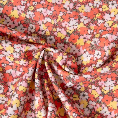 Tissu Popeline de Coton légère imprimé Inès floral décoratif rétro sur fond Corail - Par 10 cm