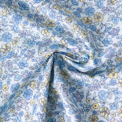 Tissu Popeline de Coton légère floral vintage sur fond Bleu ciel - Par 10 cm