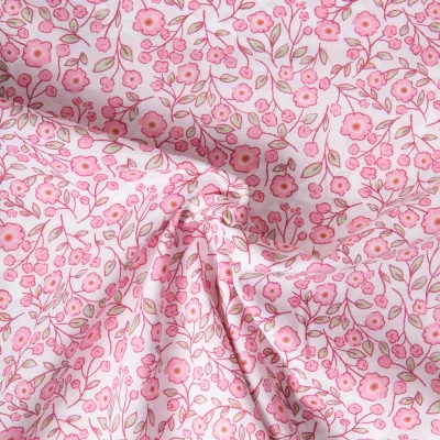 Tissu Popeline de Coton légère floral printanier rose sur fond Blanc - Par 10 cm