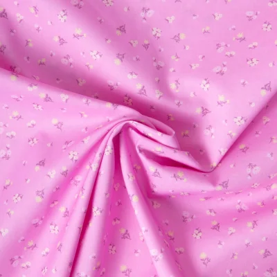 Tissu Popeline de Coton légère  Petites fleurs roses pales et jaune pastel sur fond Rose bonbon - Par 10 cm