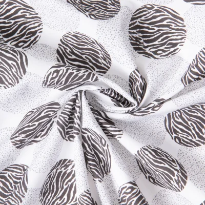 Tissu Coton imprimé Ronds zébrés sur fond Blanc - Par 10 cm