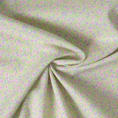 Tissu Batiste de Coton imprimé Fleuris sur fond Vert amande - Par 10 cm