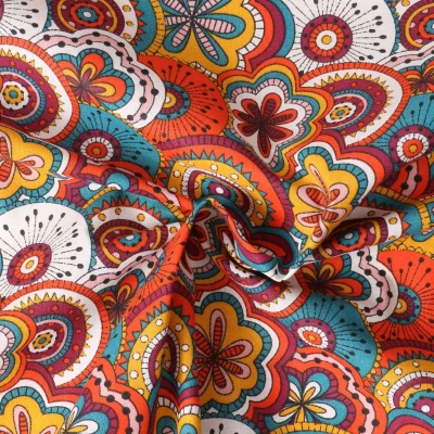 Tissu Popeline de Coton  Eugénie mandala floral Bleu sur fond Corail - Par 10 cm
