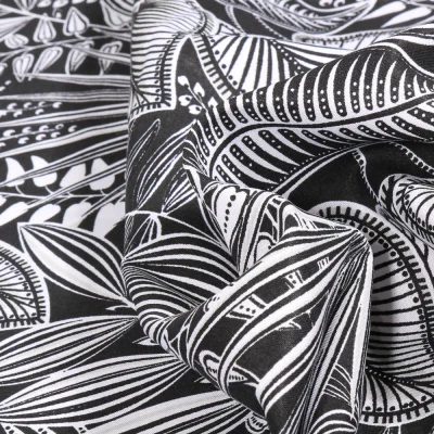 Tissu Viscose   Hevea sur fond Noir - Par 10 cm