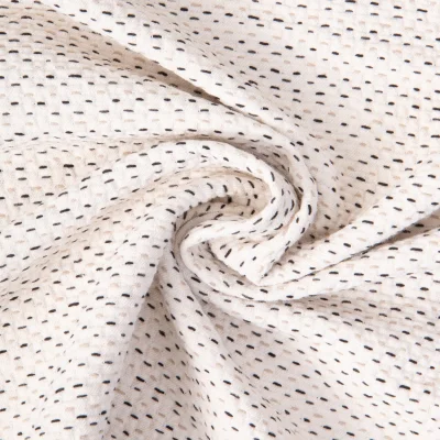 Tissu Jacquard Coton piqué pointillés Noir et Beige sur fond Ecru - Par 10 cm