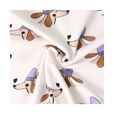 Tissu Jersey de coton Chiens et Coeurs sur fond Blanc cassé - Par 10 cm