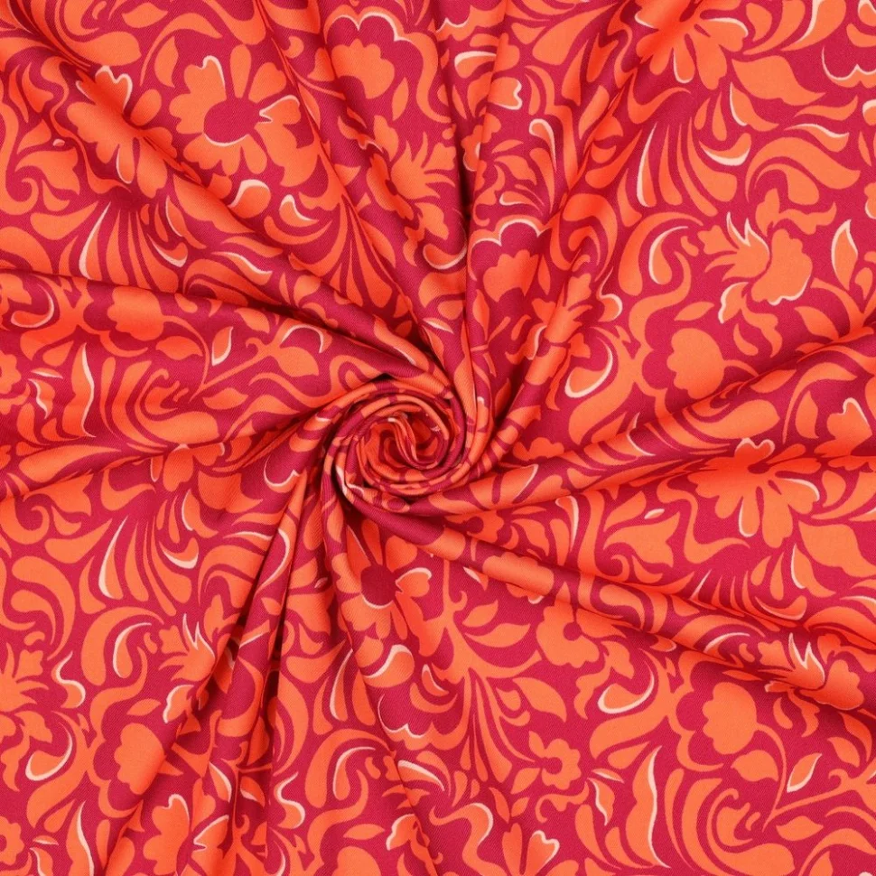 Tissu Viscose élasthanne stretch Motif floral Orange sur fond Rouge