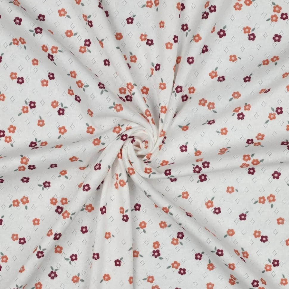 Tissu Jersey Coton ajouré Baby petites fleurs Orange et Violet sur fond Blanc
