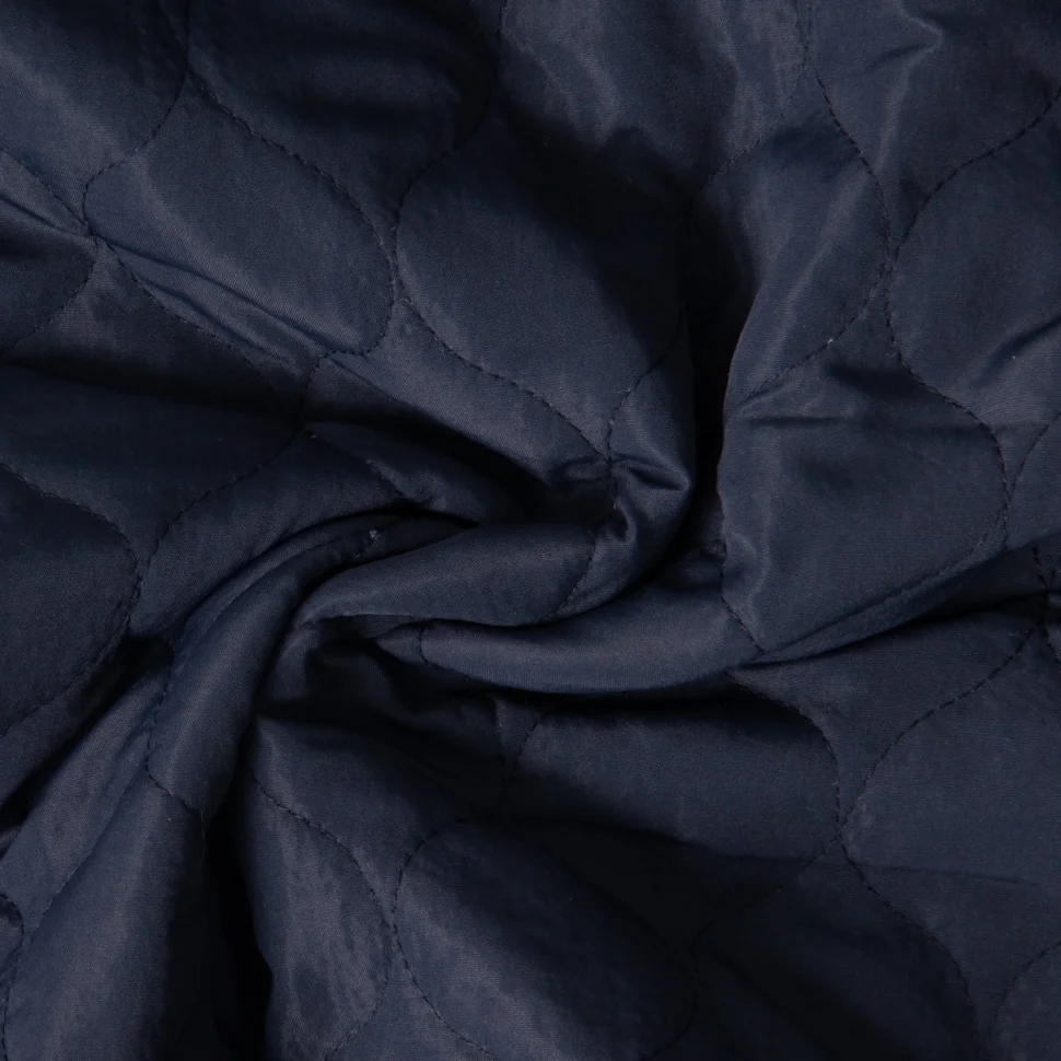 Tissu Doudoune matelassé Garance   sur fond Bleu marine