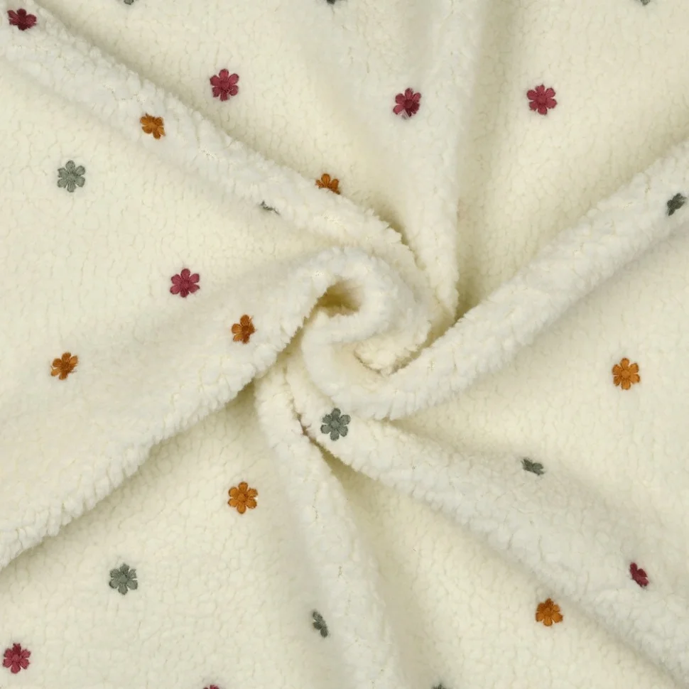 Tissu Fausse fourrure Mouton Teddy petites fleurs brodées sur fond Ecru