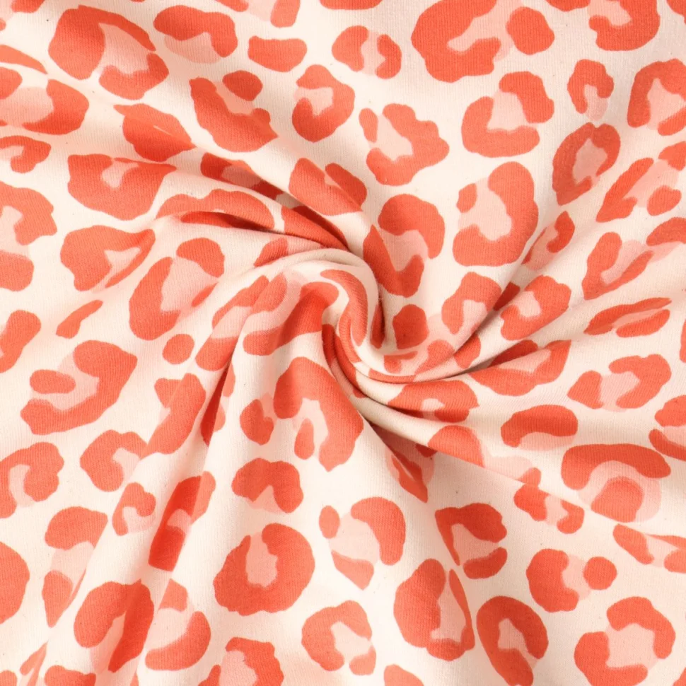 Tissu Sweat léger envers molletonné Naïa léopard Orange sur fond Beige