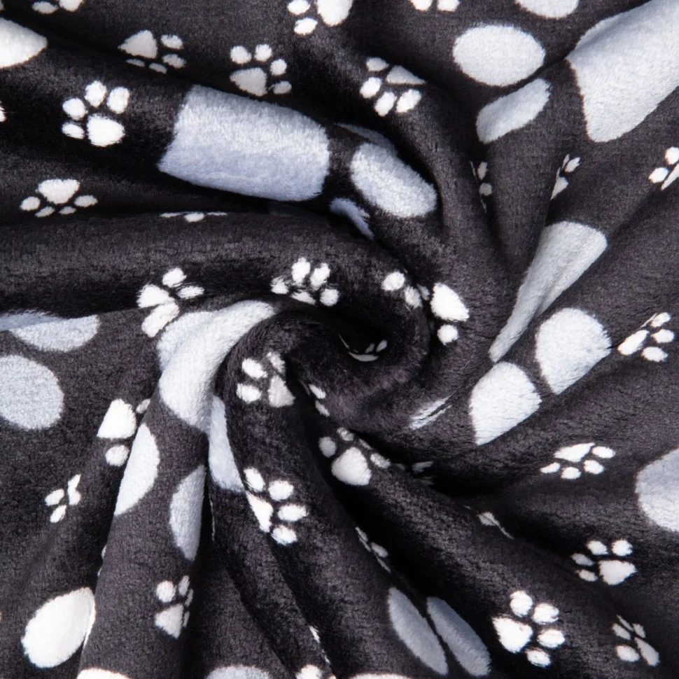 Tissu Doudou imprimé empreintes pattes sur fond Noir