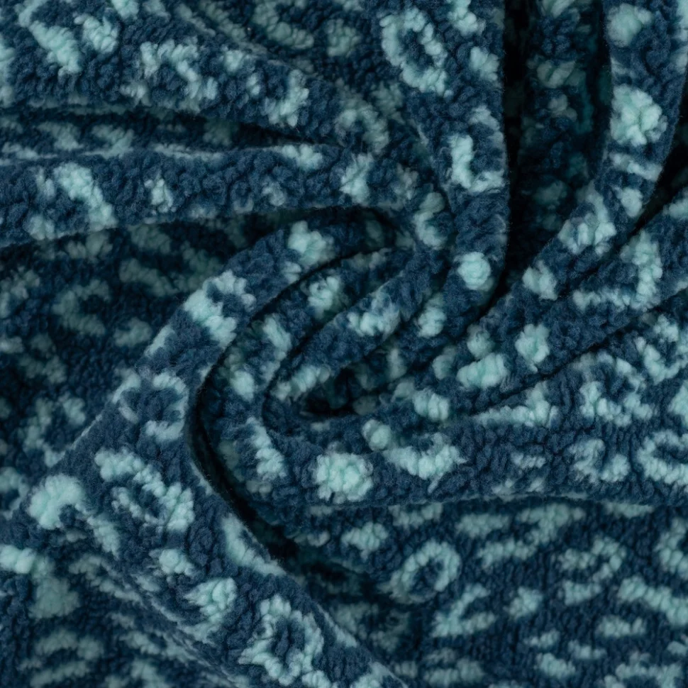 Tissu Teddy Bouclettes motif léopard Bleu ciel sur fond Bleu