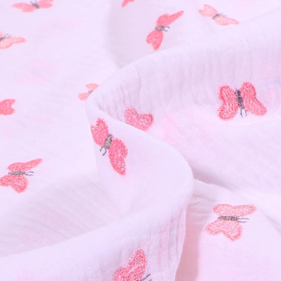 Tissu Double gaze Papillons brodés sur fond Blanc