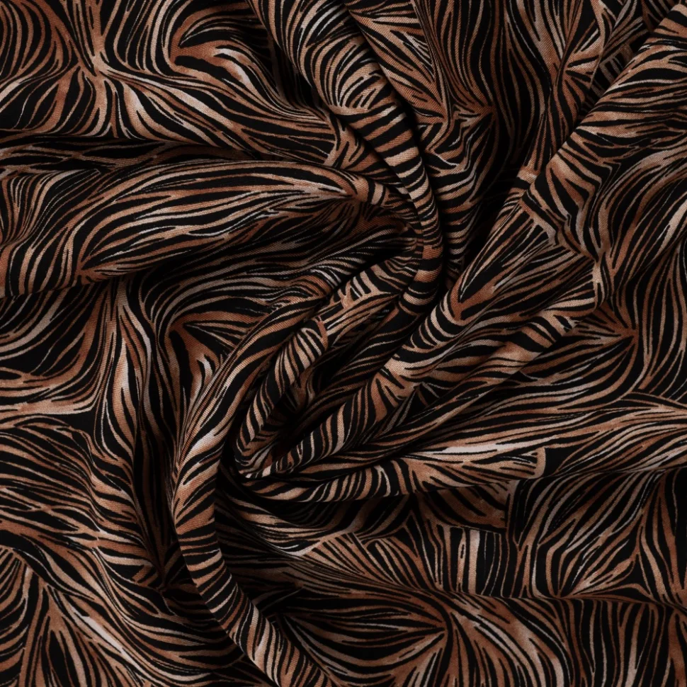 Tissu Viscose twill feuillage graphique Cognac et Noisette sur fond Noir