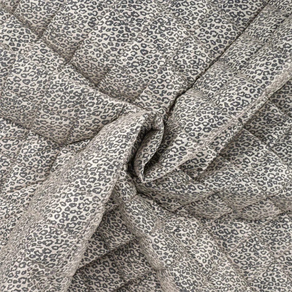 Coupon Tissu Matelassé doudoune réversible motif léopard sur fond Crème - Coupon de 30 cm
