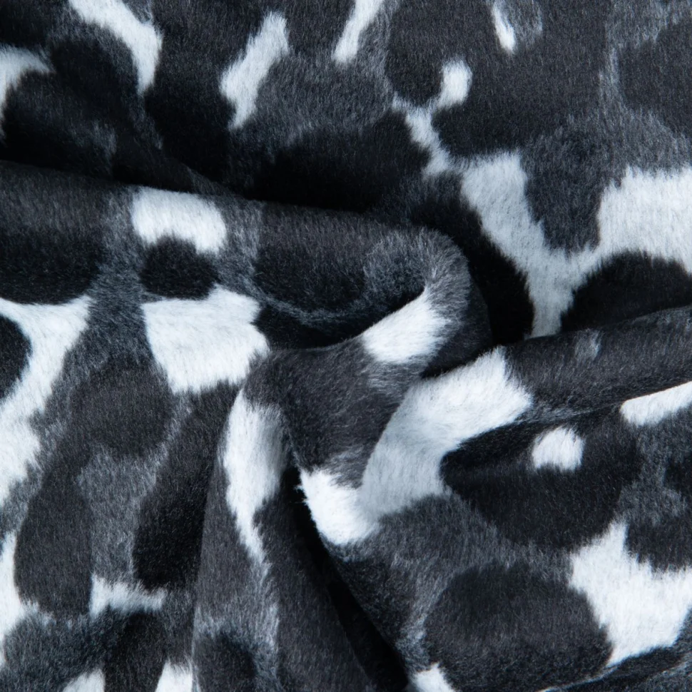 Tissu Maille Jacquard brossé imprimé Léopard noir sur fond Blanc