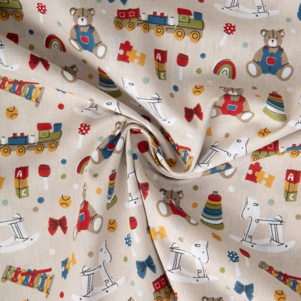 Tissu Coton imprimé Toys herault Multicolore sur fond Beige