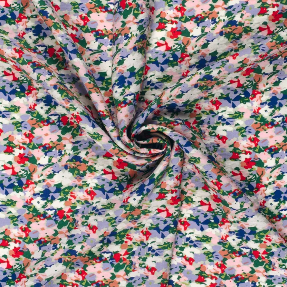 Tissu Crêpe de Viscose fleurs Lia sur fond Parme