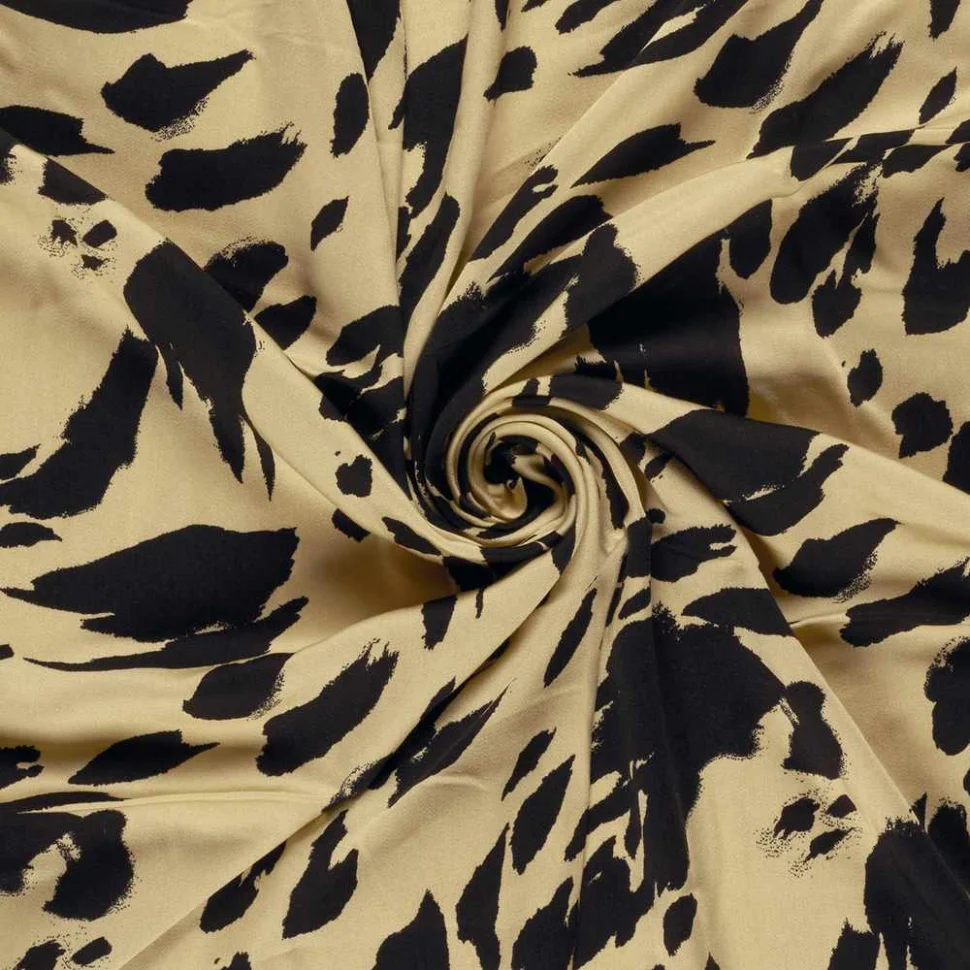 Tissu satin de viscose  imprimé tacheté noir sur fond Jaune