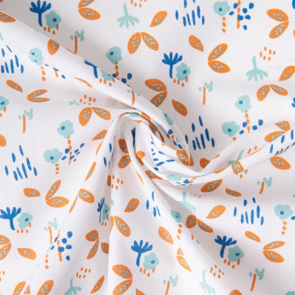 Tissu Coton imprimé Fuzy motifs fleuris bleus et orange sur fond Blanc